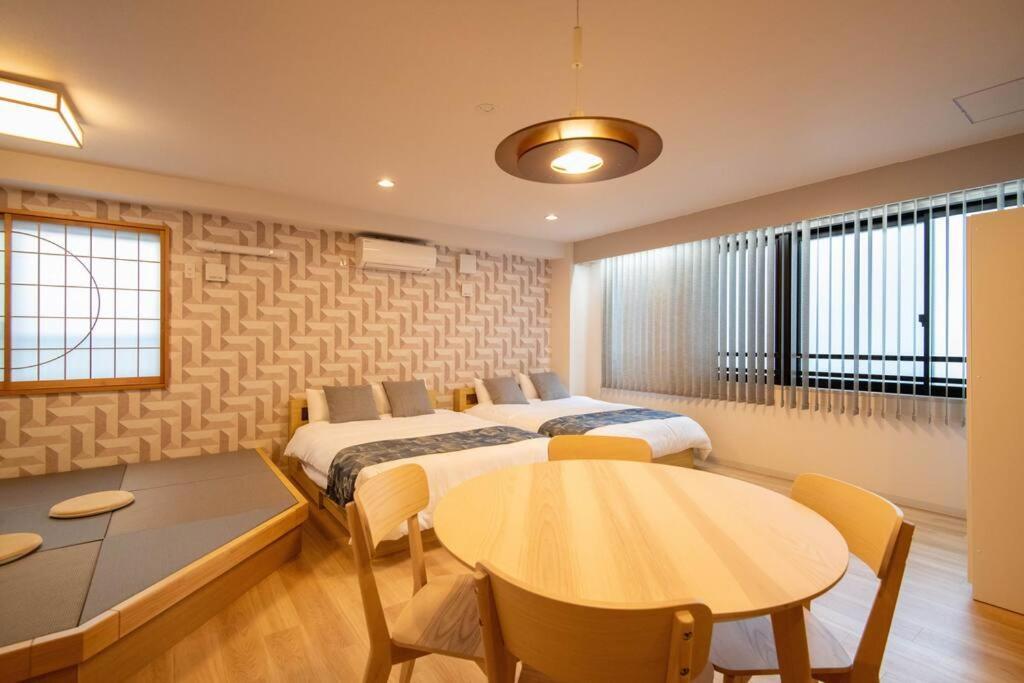 Apartamento 浅草禅心居202室 浅草駅徒歩15分 2024年4月ニューオープン 43平米丸貸し切り ダブルベット2台と畳敷き布団2組 家庭式用品設備完備